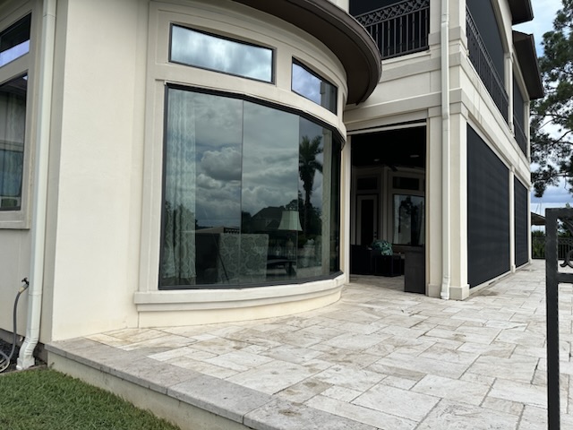 Tall patio windows and curved exterior glass